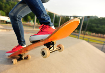  skateboarding legs at skatepark