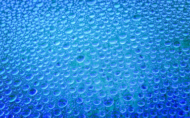 Water drop on glass background.