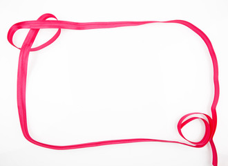blank frame made ​​of red ribbon isolated on white background