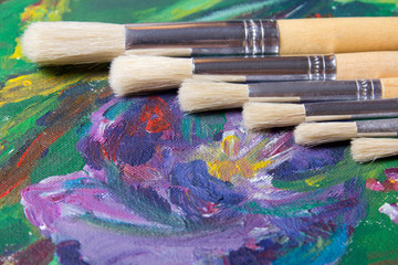 Fototapeta premium close up of acrylic paint and paint brushes set