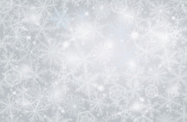 Fototapeta na wymiar Light winter background made from snowflakes.
