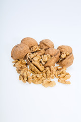 walnut and a cracked walnut isolated on the white background