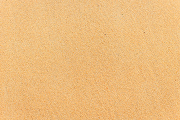Fototapeta na wymiar Texture of sand and footprints in the sand