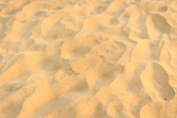 Texture of sand and footprints in the sand
