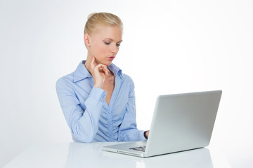 concentrated woman reads interesting article on website