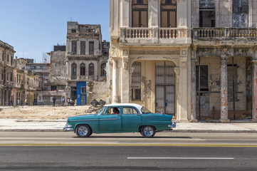 Green classic car in Havana, Cuba