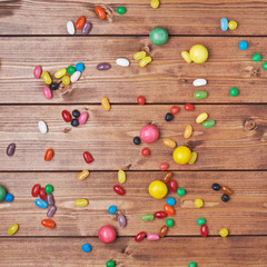 Candies lying over the wooden surface