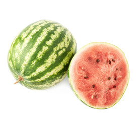 Whole watermelon next to a slice