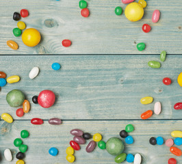 Candies lying over the wooden surface