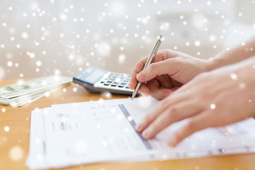 close up of man with papers doing tax report