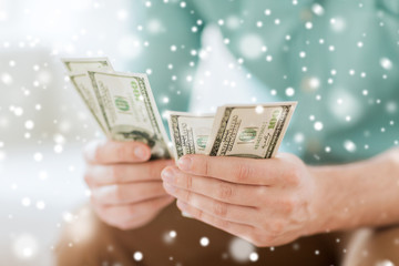 close up of man counting money at home