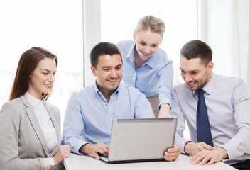 business team working with laptop in office
