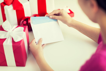 close up of woman with letter and presents