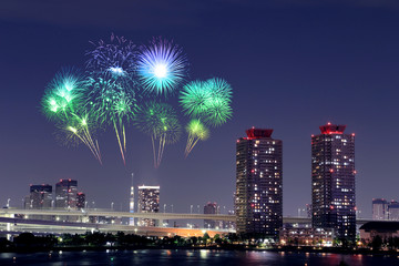 Fireworks celebrating over Odaiba, Tokyo cityscape at night