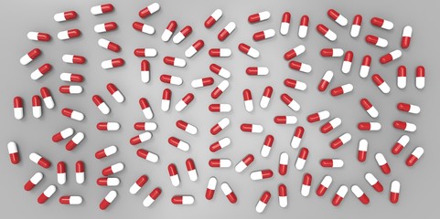red and white color pills on gray grey background