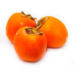 Persimon or sharon fruit isolated on a white studio background.