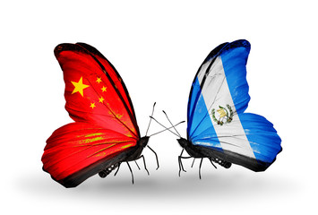 Two butterflies with flags China and Guatemala