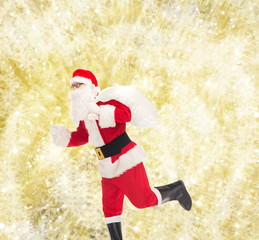 man in costume of santa claus with bag