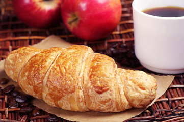 Croissant with coffee and apples