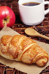 Croissant, coffee and apple