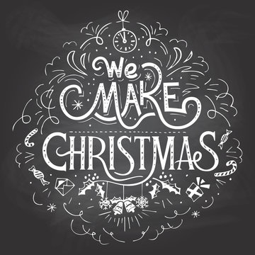 We make Christmas. Hand-lettering label on blackboard with chalk