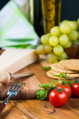 Organic cherry tomatoes and parmesan cheese on table