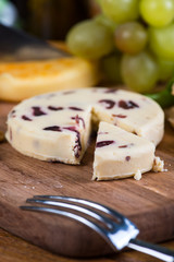 Traditional english homemade cranberry soft cheese on board