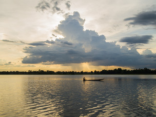 Silhouette of boat and fisherman