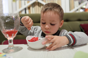 Child eating fruit ice cream