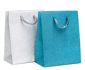 blue and silver gift bags on white background