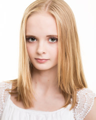 Blond Young Teenage Girl Dressed In White in the Studio