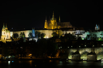 Fototapeta na wymiar Prague Castle and the Charles Bridge at night illumination.