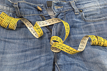 Blue jeans with measuring tape.