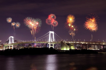Fireworks celebrating over Tokyo Rainbow Bridge at Night, Japan