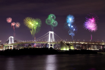 Fototapeta premium Fireworks celebrating over Tokyo Rainbow Bridge at Night, Japan