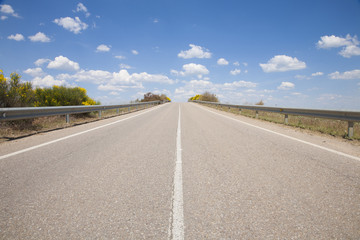 road through clouds in sky
