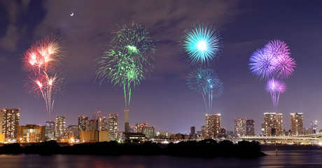 Fireworks celebrating over Odaiba, Tokyo cityscape at night