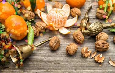 Mandarin fruits, walnuts and christmas tree branches