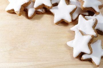 Christmas background, cinnamon stars on wooden board