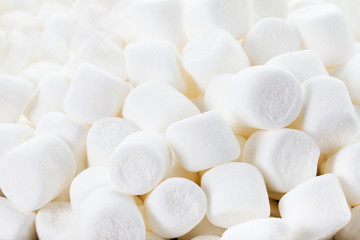 Fototapeta na wymiar White Fluffy Round Marshmallows as a background. Sweet Food Ca