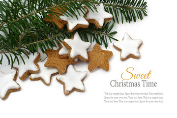 Christmas cookies, cinnamon stars, fir branches,white background