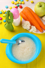 Fresh baby food in bowl with spoon