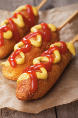 Corn dog with mustard and ketchup