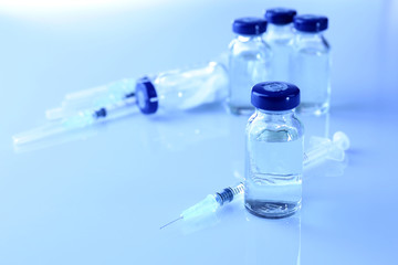 Vaccine in vial with syringe