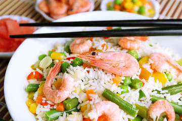 Boiled rice with shrimps and vegetables, close-up,