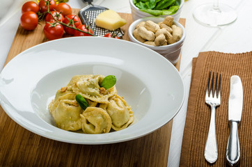 Homemade tortellini stuffed with spinach and garlic
