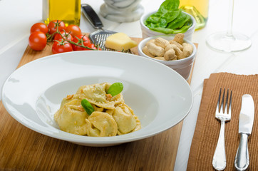 Homemade tortellini stuffed with spinach and garlic