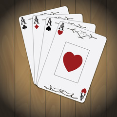 Aces poker cards varnished wood background