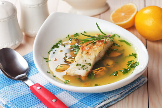 Sea food soup with cod fish steak