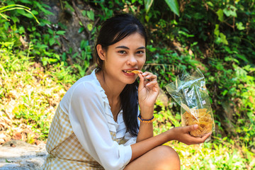 Fototapeta premium young girl eating snack